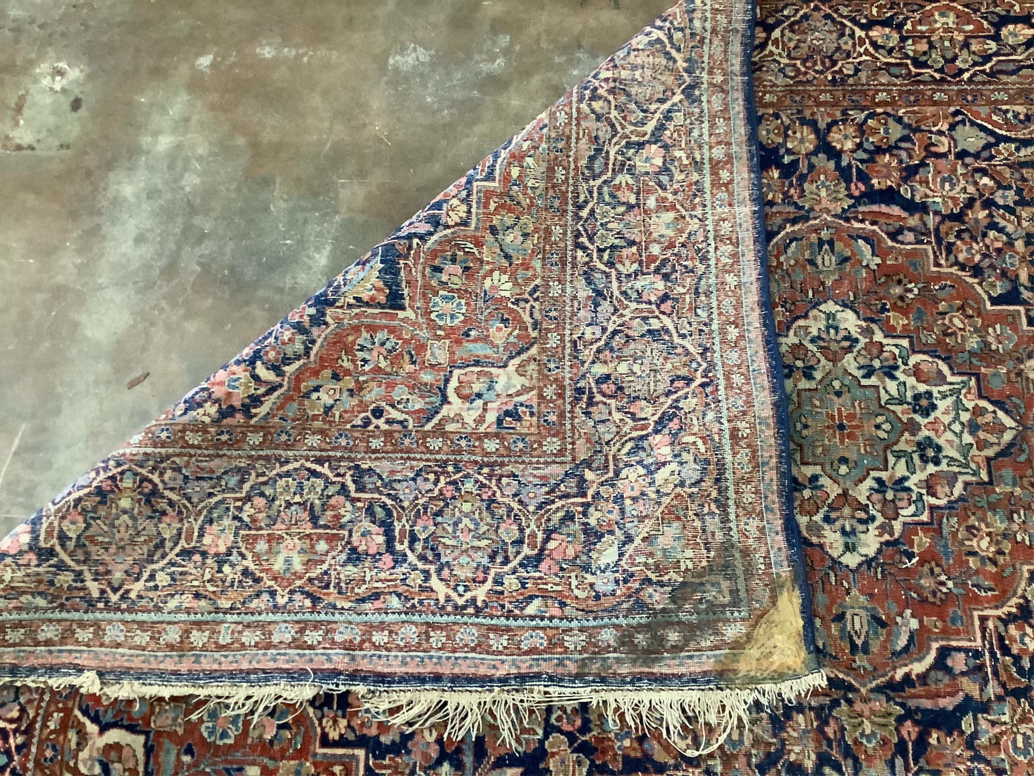 An Isphahan pink medallion rug, with a blue field, 200 x 130cm